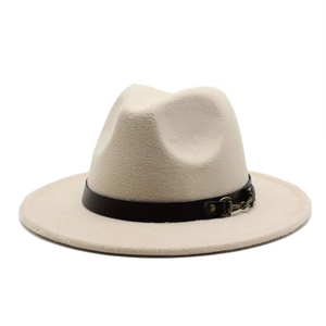 Detail of beige wool fedora featuring a black leather band and gold metal buckle