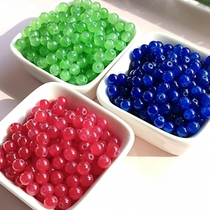 DIY 4-8mm glass beads in green, blue, and red displayed in three small white square bowls