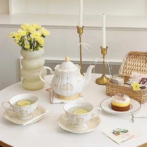 French vintage ceramic camellia tea set with teapot, cups, and trays in floral design