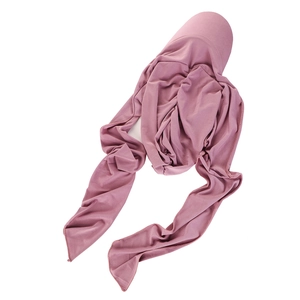 Detail of dusty pink pleated hijab headscarf with long ties on white background
