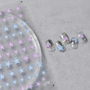 Relief star nail stickers in pink and blue colors with finished manicured nail display
