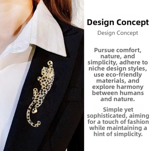 Detail of a sparkling gold leopard brooch with black crystals on a black suit lapel