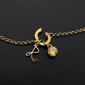 Elegante gouden titanium stalen ketting met letter A hart hanger en geel kristal