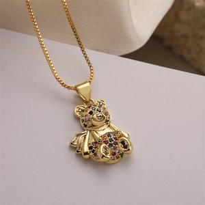 Detailed macro view of a 3D teddy bear pendant with colorful sparkling zircons