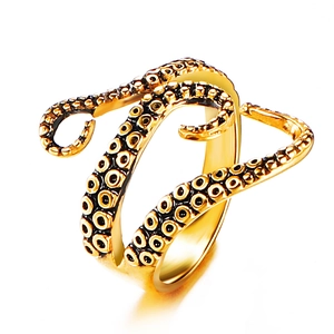 Detailed view of golden octopus tentacle ring with realistic sucker texture and retro style