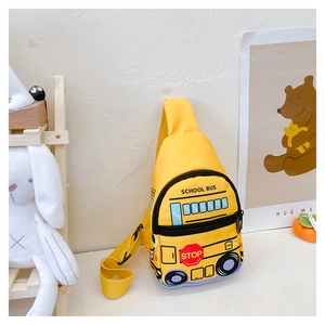 Detail view of the yellow school bus crossbody chest bag with functional pockets