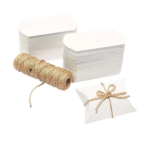 White pillow favor boxes set with natural twine roll and unfolded paper cardboards