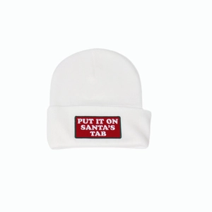 White knit beanie with Put It On Santa's Tab embroidered patch for Christmas winter fashion