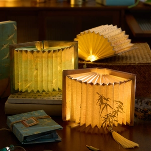 Artistic fan-shaped book lamps with landscape patterns and poetic Chinese calligraphy