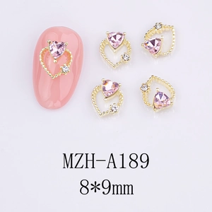 Pink heart-shaped 3D nail zircon charms with gold metal hollow design in 8x9mm size
