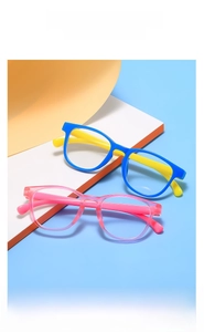 Detailed view of colorful kids anti-blue light glasses in blue, yellow and pink frames