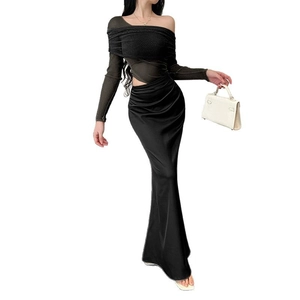 Elegant two-piece black off-shoulder long sleeve top with matching satin mermaid maxi skirt