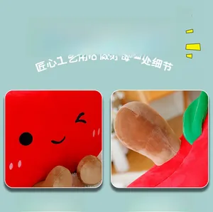 Detail of cute red apple plush toy with embroidered facial features and 3D leaf stem
