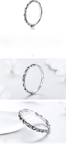 Macro shot of 925 sterling silver ring featuring intricate vintage vine carvings and S925 stamp
