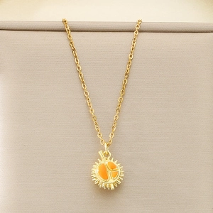 Close-up of golden titanium necklace featuring a creative durian fruit pendant with orange enamel