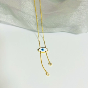 Titanium steel evil eye tassel necklace with gold chain and sparkling zircon accents