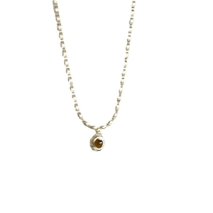 Bamboo style silver necklace with oval amber pendant on white background for women