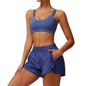 Women's dark blue quick-dry yoga set with strappy sports bra and wide-leg shorts