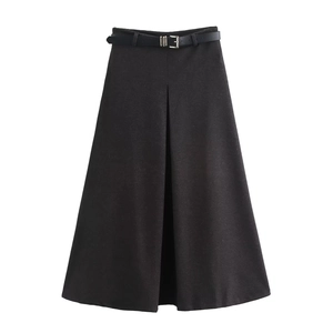 Detail of a black A-line wool skirt featuring a stylish front slit and matching leather belt