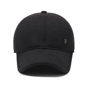 Men's winter black baseball cap with ear flaps and metal shield logo for cold weather