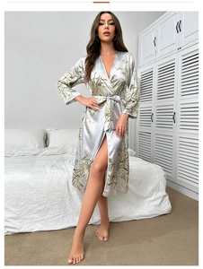 Detail of grey ice silk robe featuring delicate yellow flower prints and smooth satin texture