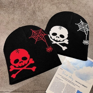 Y2K street style knitted beanies featuring red and white skull and crossbones graphics
