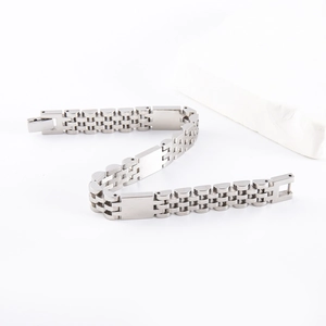 Detailed view of silver stainless steel five-link chain bracelet with matte and polished finish