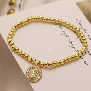 Goldenes Kugelarmband mit Jungfrau Maria Medaillon und funkelnden Zirkonia-Steinen