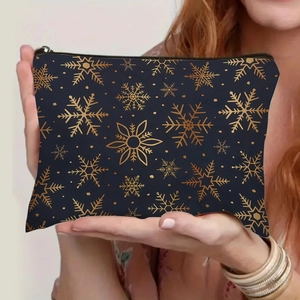 Navy blue makeup bag with gold snowflake print, stylish handheld cosmetic storage pouch