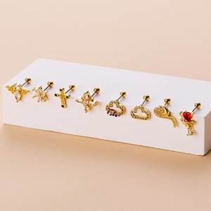 Detailed set of golden stainless steel helix studs with butterfly and snake charms