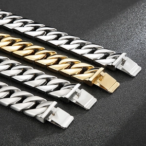 Detailed macro view of heavy Cuban link chains with secure double-lock box clasps