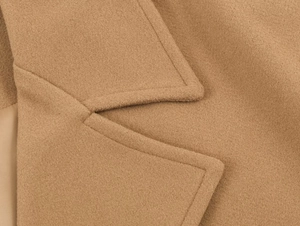 Close-up of premium camel wool coat collar showing precise stitching and fabric texture