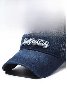 Close-up of vintage distressed blue denim baseball cap with New York City embroidery