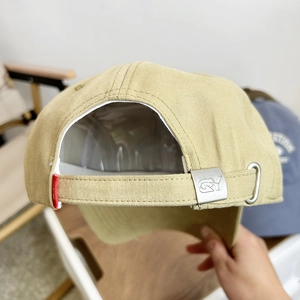 Adjustable khaki cotton baseball cap with premium metal buckle and red side tag detail
