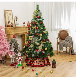Detail of red and black plaid Christmas tree skirt with Merry Christmas deer print