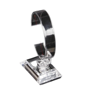 Clear acrylic watch display stand with C-ring holder and rectangular base on white background