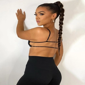 Women black backless sports bra and high waisted yoga leggings set for fitness