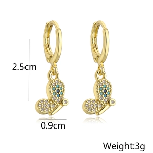 Detail shot of 18K gold plated butterfly earrings with dimensions 2.5cm height and 3g weight