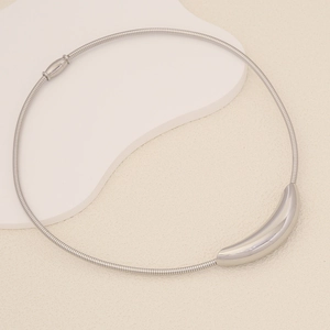 Minimalist silver stainless steel choker necklace with sleek curved pendant on snake chain