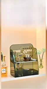 Detailed view of green PET organizer with hooks for jewelry and cosmetic storage