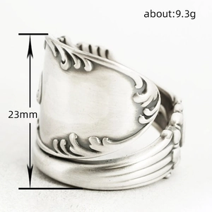 Vintage silver spoon ring with floral relief pattern and adjustable open band design