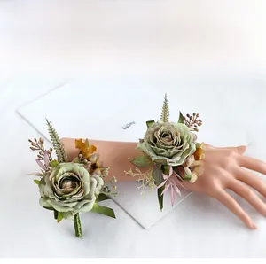 Detail of vintage green artificial rose corsage and wrist flower set for weddings