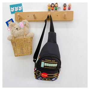 Detail of cute school bus pattern on black kids crossbody bag with adjustable strap