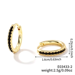Detailed view of gold hoop earrings with black zircon stones and size specifications