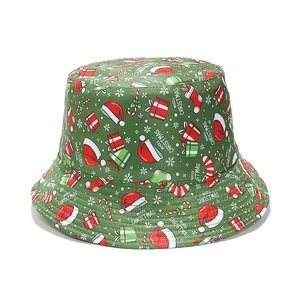 Green cotton Christmas bucket hat featuring festive Santa and snowflake patterns