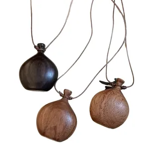 Bohemian wax rope wood bottle pendant necklace in ebony and natural wood finish