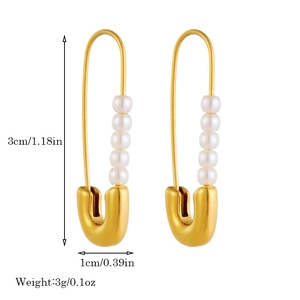 Golden safety pin earrings with five white pearls showing dimensions 3cm by 1cm