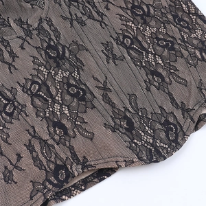 Close-up showing the floral lace pattern and dual-layer stitching of the corset top