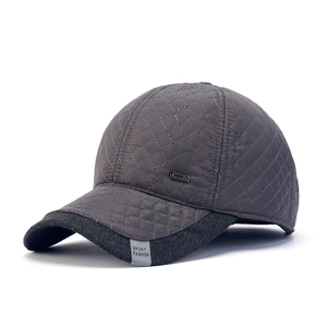 Dark grey winter baseball cap for men featuring quilted fabric and warm ear protection