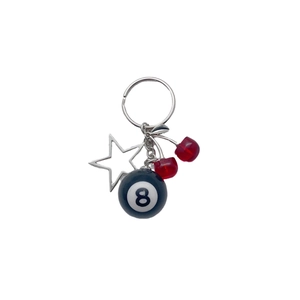 Metal keychain featuring cherry pendant, black 8-ball charm and hollow silver star